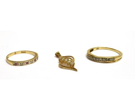 TWO 9CT GOLD RINGS AND A PENDANT comprising; a small ruby and diamond seven stone half-eternity ring, London 1992, size L+, 1