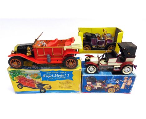 THREE TINPLATE CARS  comprising a Kraftoy (Japan) Ford Model T, red with a black bonnet, with a battery-operated mystery acti