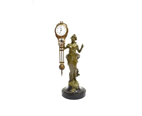 AN ART NOUVEAU STYLE CONTINENTAL BRONZED SPELTER MYSTERY CLOCK  modelled as a lady in flowing dress supporting the clock and 