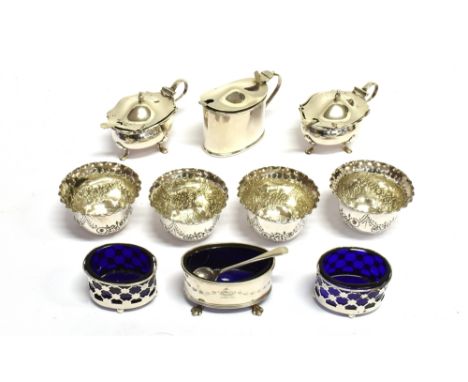 TEN VARIOUS VICTORIAN AND LATER SILVER CRUETS  comprising; a set of four late Victorian swag-embossed round salts with crimpe