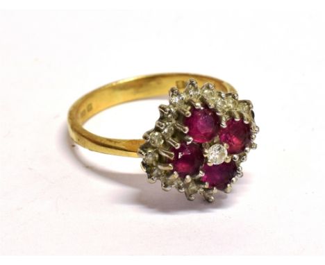 A MODERN 18CT GOLD, RUBY AND DIAMOND LOZENGE-SHAPED CLUSTER RING centred with a small diamond within four round mixed-cut rub