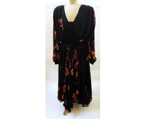 A black chiffon maxi dress by Wayne Clark Studio, printed with Chinese style goldfish, bugle bead decoration to drop waist an