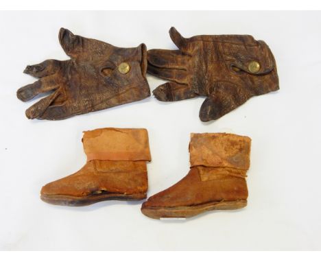 A pair of leather baby shoes possibly circa 1850 and a pair of child's leather gloves with a stud button 