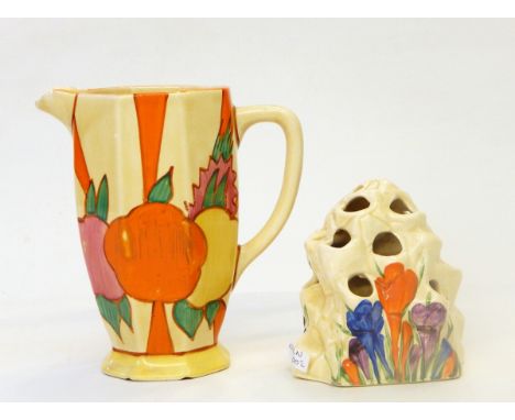 A Clarice Cliff Bizarre 'Crocus' pattern rock flower holder, 11cm high and a Bizarre jug, 16cm high (chip and crack to spout)