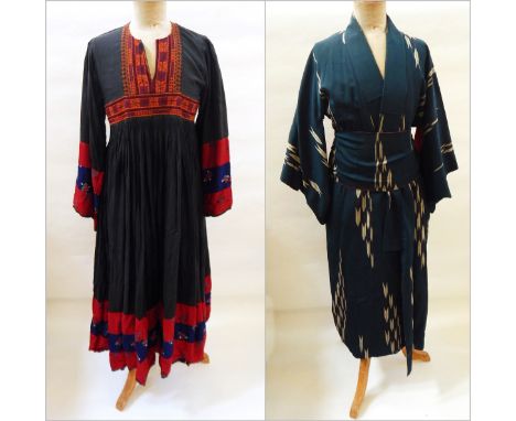 A Japanese kimono with broad sash, slashed sleeve, geometric pattern with an Afghan dress with full pleated skirt and embroid