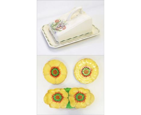 A Susie Cooper butter dish and cover painted with daisies and other flowers within a green border and a set of five Royal Dou