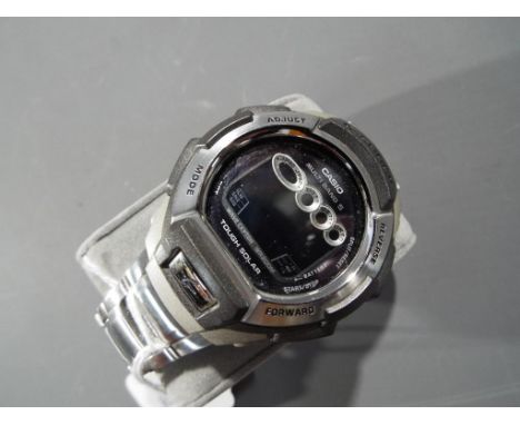 Casio - a Casio G-Shock digital wristwatch with stainless steel strap, appears unused This lot must be paid for and collected