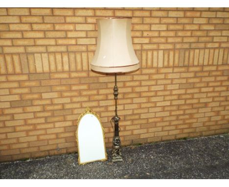 A decorative top arch wall mirror and a standard lamp measuring approximately 160 cm with shade. This lot must be paid for an