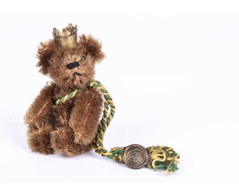 A post-war Schuco BP Teddy Bear, with brown mohair, black pin eyes, black stitched nose and mouth, metal framed jointed body,