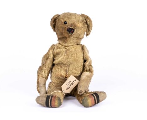 Bristol’, a German Teddy Bear, circa 1910, lost at Bristol Airpot in 2012, with blonde mohair, black boot button eye, pronoun