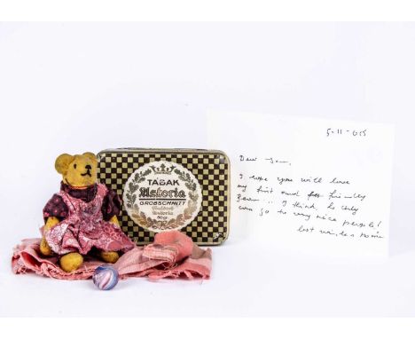 Marie Robischon’s first ever Teddy Bear she made when she was just 6 years old,  the yellow cloth bear with stitched eyes, no