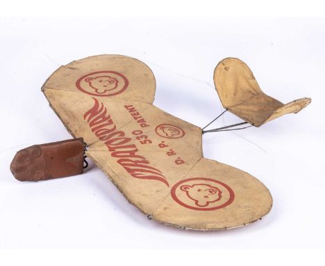 A Steiff 530 Stratosplan toy aeroplane,  with rubber Teddy Bear head front and paper wings and tail fin on wire frame, the wi