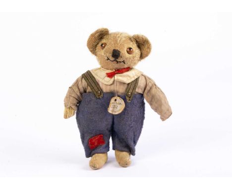 A rare Chiltern Master Teddy, circa 1915,  with blonde mohair head, hands and feet, brown and black glass google eyes, crosse