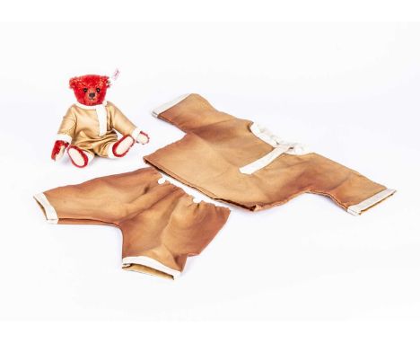 A Steiff limited edition Pocket Alfonzo, 69 of 1908 —5 ½in. (14.5cm.) high and a silk Cossack style Teddy Bear outfit