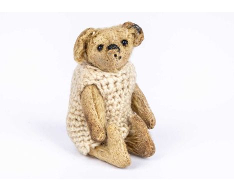 Theodora’, a Steiff miniature Teddy Bear, 1910-20,  with golden mohair, black bead eyes, remains of black stitched nose and m