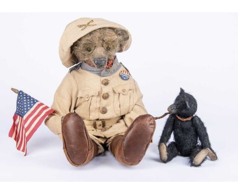 A Sue Lain (USA) Teddy Roosevelt Bear in Rough Rider uniform and black bear cub, circa 2001, with brown mohair, black boot bu