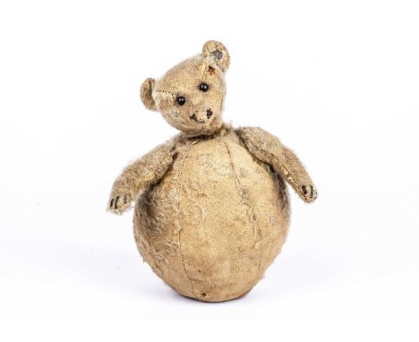 A rare Steiff Roly-Poly Teddy Bear, circa 1909, with blonde mohair, black boot button eyes, pronounced muzzle, remains of bla