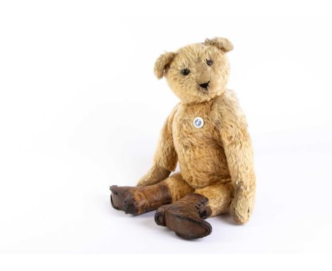 ‘Boots’, an early German Teddy Bear, circa, 1910, one of Colonel Bob Henderson’s favourite bears, with golden mohair, black b