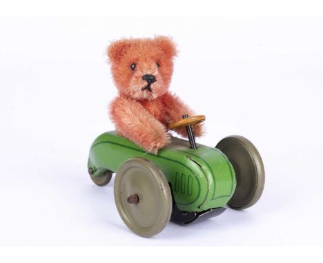 A rare and fine Schuco Teddy Bear roller toy, 1920s, with rose pink mohair Teddy Bear torso with black pin eyes, black stitch