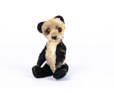 Ming, a small Chad Valley panda Teddy Bear, 1930s, with white and black artificial silk plush, orange and black glass eyes, p
