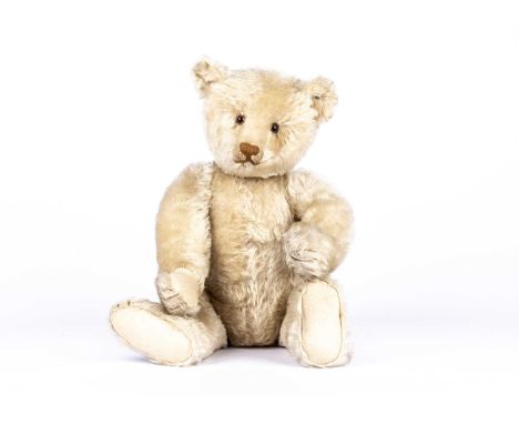 ‘Xenia’, a fine Steiff white mohair Teddy Bear, 1912-15,  with clear and black glass eyes with brown backs, pronounced part c