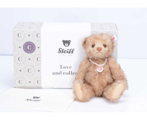 A Steiff limited Happy Teddy Bear,  50 of 1000, in original box with certificate, 2023 —9 ½in. (23.5cm.) high and a self-publ