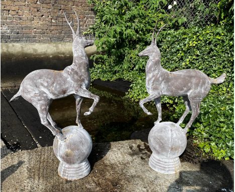 ARCHITECTURAL GARDEN STAG FINIALS, a pair, cast metal, 100cm x 60cm. (2) 