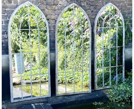 ARCHITECTURAL GARDEN WALL MIRRORS, set of three, 160cm high, 67cm wide, Gothic arched metal frames. (3) 
