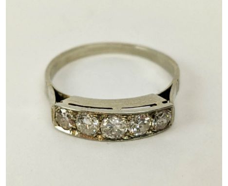 A FIVE STONE DIAMOND RING, tests as white gold, the channel set stones of graduated size, the largest central stone approxima