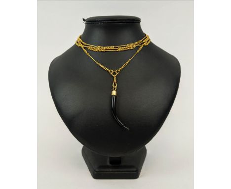 AN 18CT GOLD ALBERT CHAIN, with a ebony tusk pendant, 142 cm / 56 inches long, total gold weight, 35 grams, complete with box