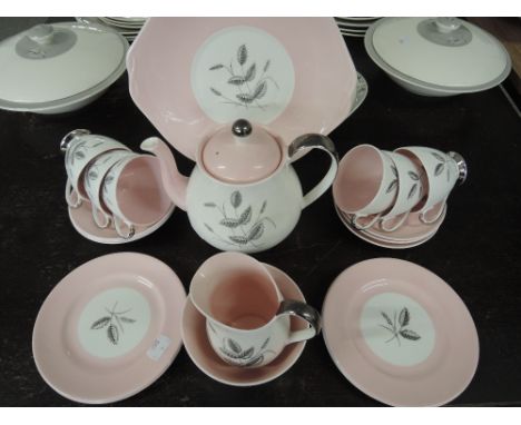 A Queen Anne 'Harvest Pink' part tea service (22 pieces approx)