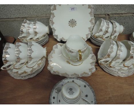 A vintage gilt and white tea service, 40 pieces, and Royal Standard cup and saucer