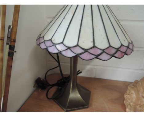 A Tiffany style lamp with bronze effect base