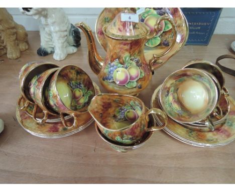 A Baroness part tea service in transfer printed fruit and gilt design by A Mellori, 22 pieces