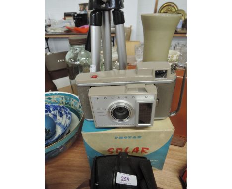 A selection of vintage cameras and tripod including Polaroid and Envoy etc