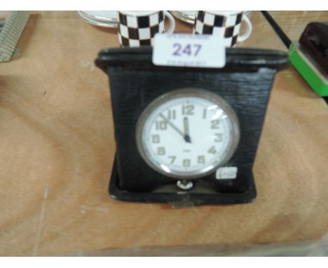 A vintage eight day travel clock Swiss made