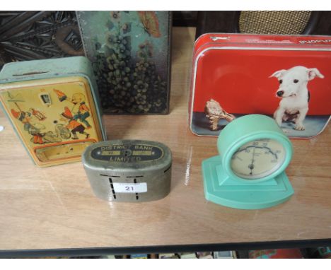A selection of vintage advertising tins, money box and bakelite thermometer 