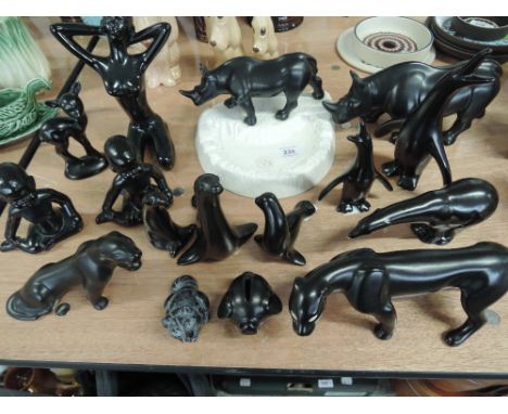 A selection of black ceramic figures and animal studies
