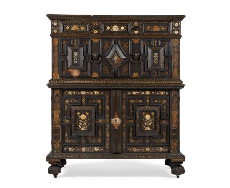 Y A CHARLES II PAINTED OAK, MOTHER OF PEAR AND BONE INLAID ENCLOSED CHEST OF DRAWERSCIRCA 1660 With cushion frieze drawer abo