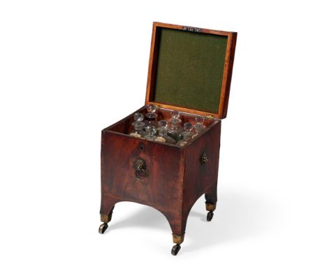 A REGENCY MAHOGANY AND LINE INLAID CELLARETCIRCA 1815The hinged lid enclosing a fitted and divided interior with a set of sev