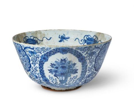 A BRISTOL DELFT BLUE AND WHITE DATED COMMEMORATIVE PUNCH BOWLDATED 1717Painted with panels of flowers and with initials BRE, 