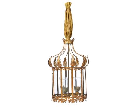 A PRESSED GILT METAL TEN GLASS LANTERN IN THE REGENCY STYLE DESIGNED BY OLIVER MESSEL With chamfered cresting and apron, with