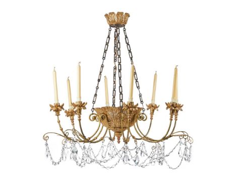 A PAINTED AND GILTWOOD AND COMPOSITION EIGHT LIGHT CHANDELIERDESIGNED BY OLIVER MESSELLThe acanthus cast basket supporting ni