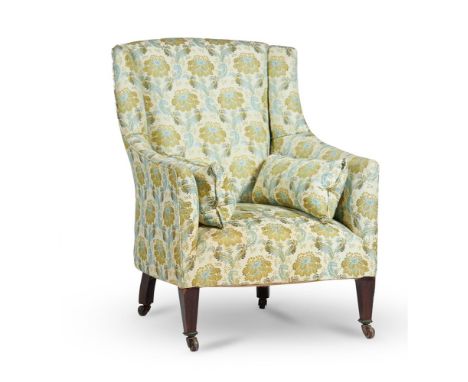 A LATE VICTORIAN MAHOGANY AND UPHOLSTERED TUB ARMCHAIRCIRCA 1900, IN THE MANNER OF HOWARD & SONS On square tapering supports 