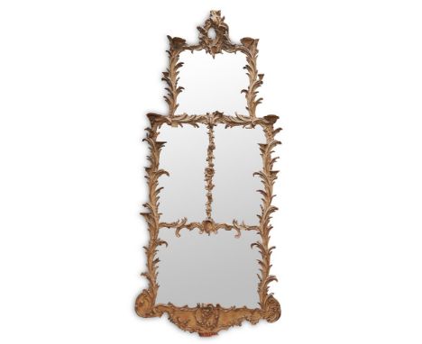 AN EARLY GEORGE III CARVED PINE AND CARTON PIERRE WALL MIRROR CIRCA 1760The frame carved with acanthus carved C-scrolls, the 