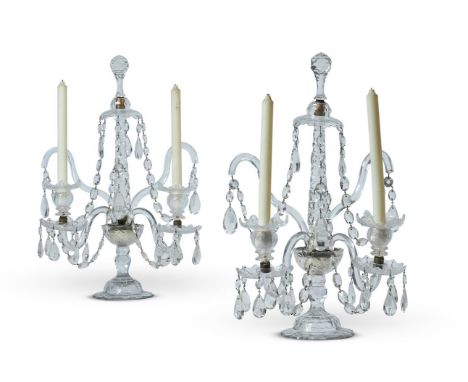 A PAIR OF FOUR BRANCH TWO LIGHT FACETED GLASS CANDELABRA 20TH CENTURY IN THE LATE 18TH CENTURY MANNER The tapering stems with