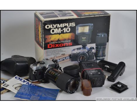 An original Olympus OM-10 together with  lens in the original box