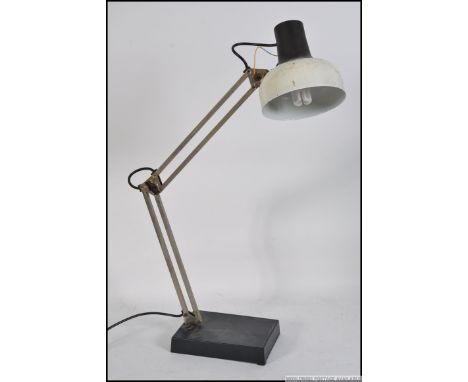 A Vintage 20th century retro LIVAL anglepoise lamp having a white pendant shade and black body