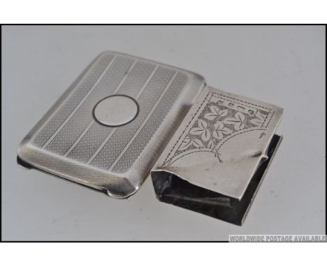 A silver hallmarked engine turned match book holder, having assay marks for Birmingham, makers marks for William Base and Co 