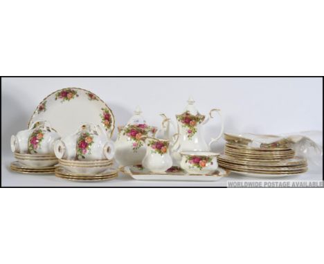 A very large collection of Old Country Roses by Royal Albert . First issue bone china . Including : Coffee Pot , 6 dinner pla